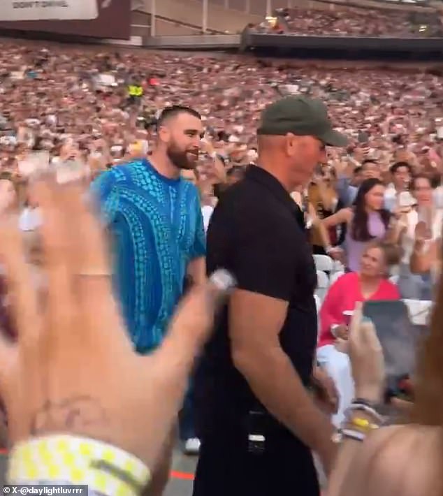 Fans shouted and waved as he walked by, with the tight end waving back at the Swifties