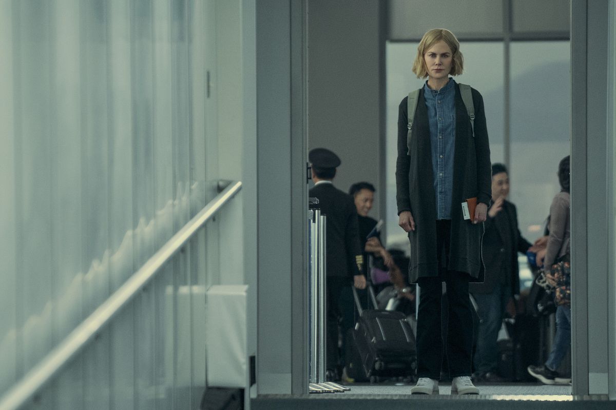 Margaret (Nicole Kidman) stands alone at the top of an airplane jetway