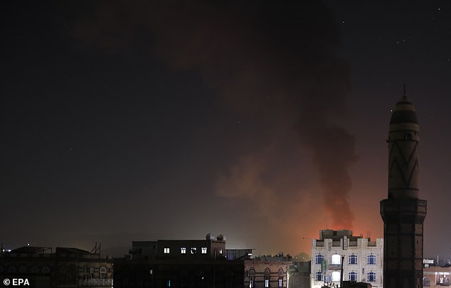 The joint operation targeted weapons storage facilities, drones, air defense systems, radars and a helicopter, and other unmanned surface and underwater vehicles.  Pictured: Smoke over Sana'a, Yemen, on February 24, 2024