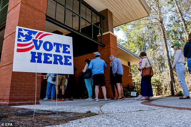 Voters line up to cast their ballots during the South Carolina Republican presidential primary on John's Island, South Carolina on Saturday, February 24