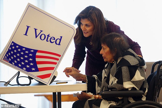 Haley (left) assists her mother Raj (right) at the polling place on Kiawah Island on Saturday.  She spoke to reporters about how 