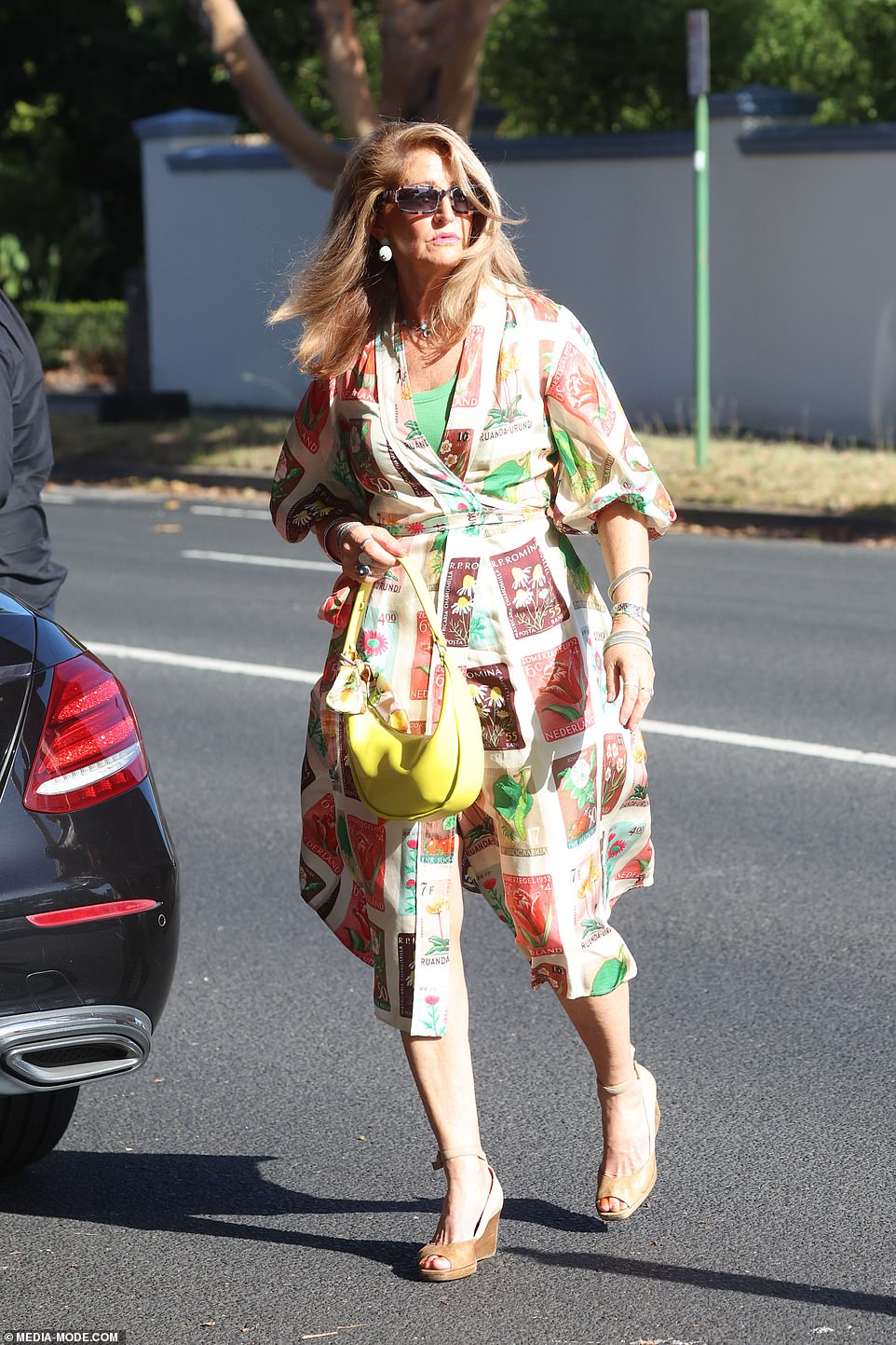 In addition to the big name politicians, guests from the business world included ANZ head Shayne Elliott, Allan Myers, Michael Chaney, Jack Cowin, Sir Rod Eddington, Ashok Jacob and Roger Corbett.  The photo shows a woman arriving