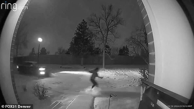 It happened last Friday and in one of the houses the unnamed woman was captured frantically wading through the snow as the car followed close behind.