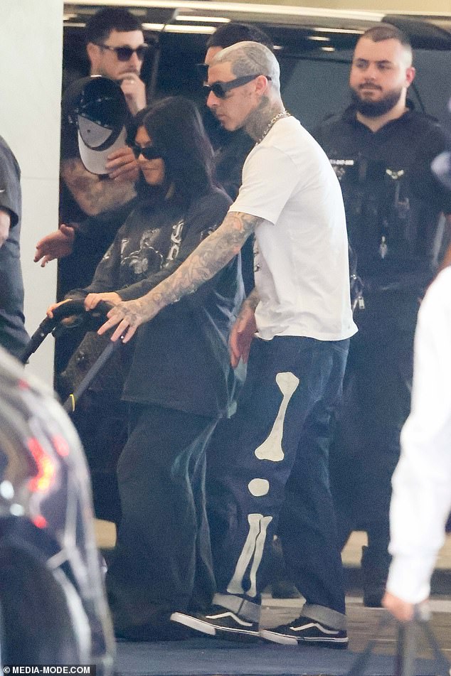 1708844906 904 Kourtney Kardashian and Travis Barker cut casual figures as they