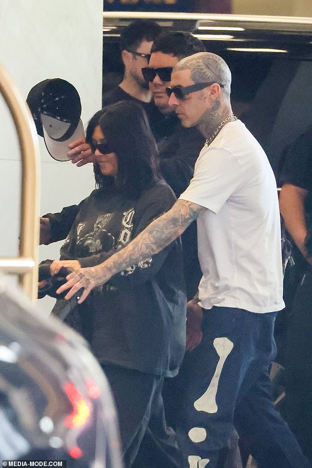 1708844909 147 Kourtney Kardashian and Travis Barker cut casual figures as they