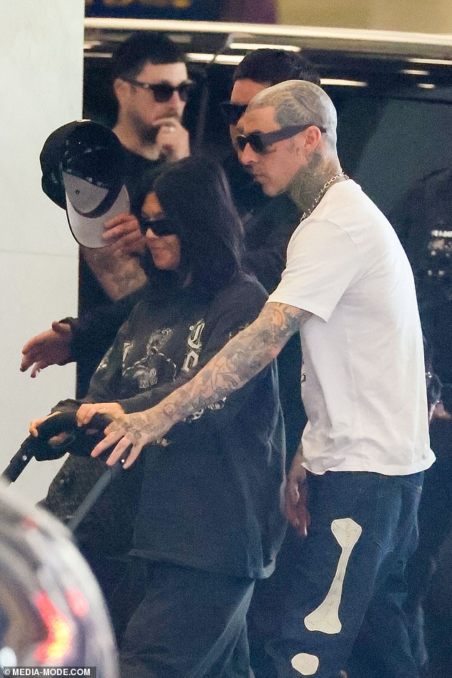 1708844913 582 Kourtney Kardashian and Travis Barker cut casual figures as they