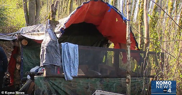 Irwin seems quite settled in the camp, with clothes hanging along a fence