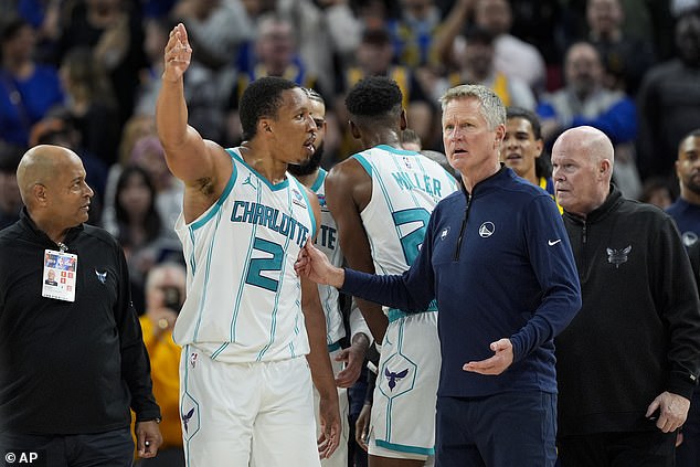 Williams can be seen talking to Warriors coach Steve Kerr in San Francisco on Friday evening