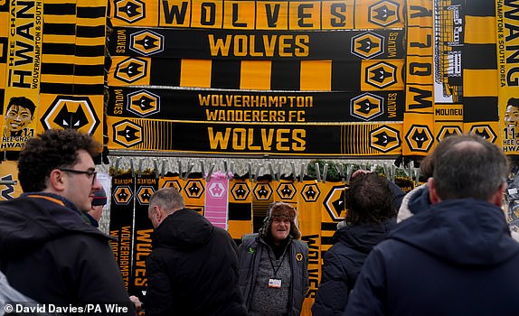 Wolverhampton Wanderers scarves and merchandise for sale outside the ground for the Premier League match at Molineux Stadium, Wolverhampton.  Date of photo: Sunday, February 25, 2024. PA Photo.  See PA story FOOTBALL Wolves.  Photo credits should read: David Davies/PA Wire.  RESTRICTIONS: FOR EDITORIAL USE ONLY No use containing unauthorized audio, video, data, fixtures, club/league logos or "live" Services.  Online use during matches limited to 120 images, no video emulation.  No use in betting, competitions or publications about one club/competition/player.