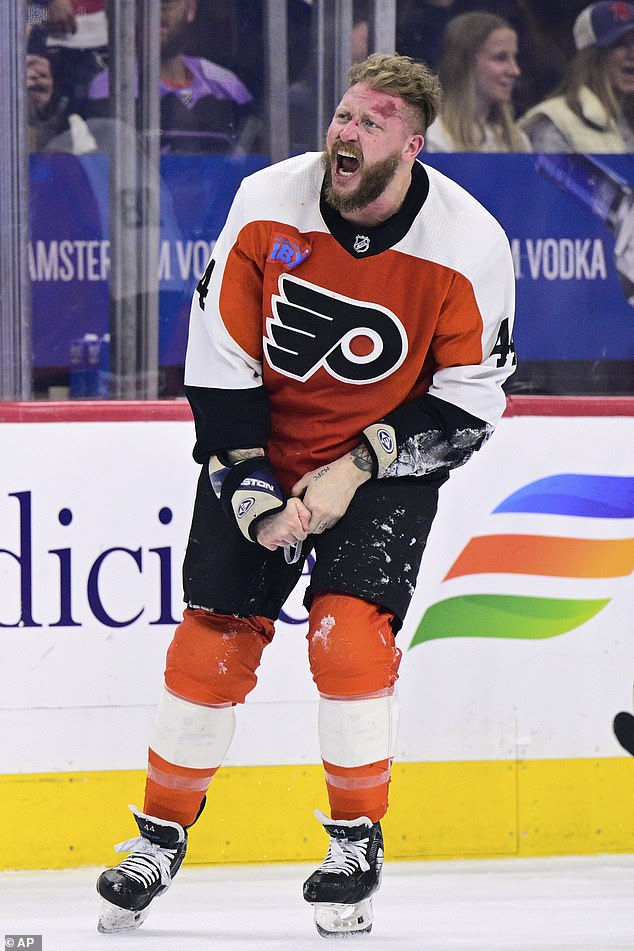 A slightly deformed Flyers player Nicolas Deslauriers reacts after the first period fight on Saturday