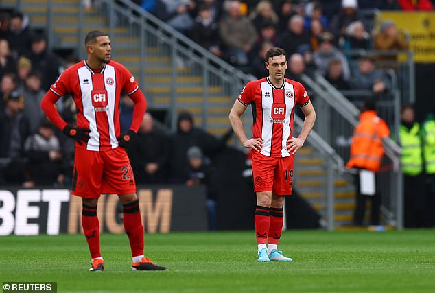 Sheffield United teammates Vinicius Souza (L) and Jack Robinson (R) collided during the match