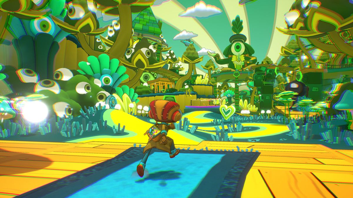 Raz runs to a lush, psychedelic level covered in eyeballs in a screenshot from Psychonauts 2