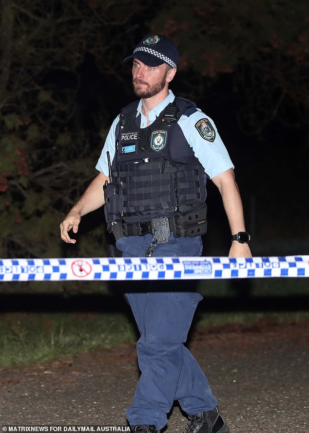 Police are relying on CCTV, toll road payments and mobile GPS data to piece together events in the days after the alleged double murder (photo: an officer at the crime scene on Sunday evening)