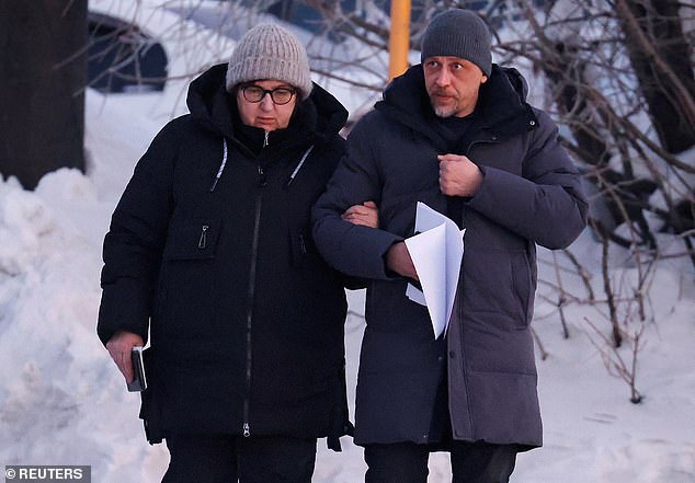 Alexei Navalny's mother Lyudmila Navalnaya and lawyer Vasily Dubkov arrive in the city of Salekhard on February 17 before being told they could not see the body