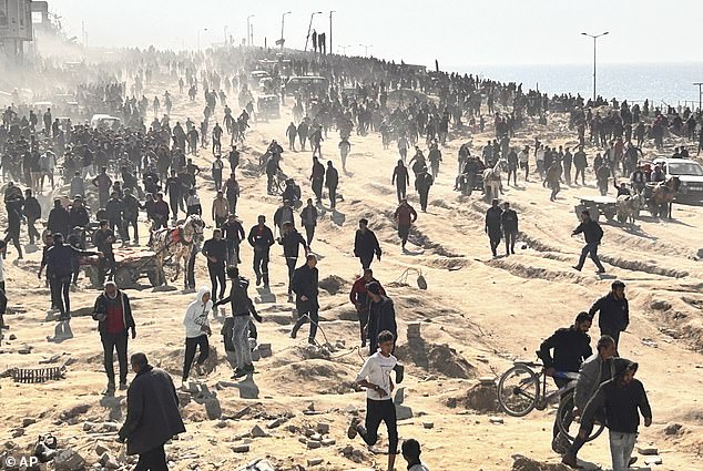 Heartbreaking photos have emerged of hundreds of displaced Palestinians, including children, gathering on a beach in Gaza City