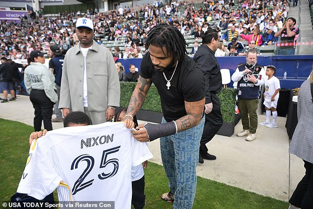 Green Bay Packers cornerback Keisean Nixon shows off his personalized Galaxy jersey