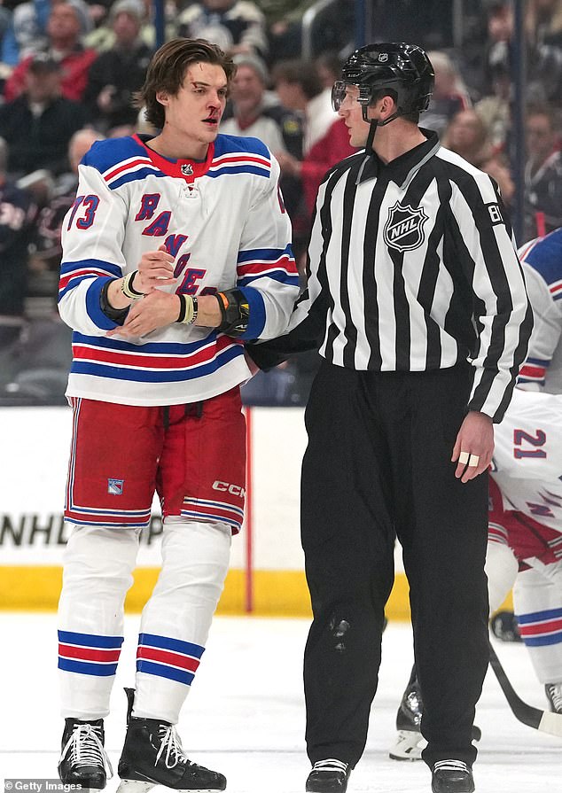 Rempe is escorted to the penalty area on Sunday evening with blood from his nose