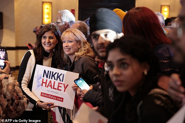 US Republican presidential candidate and former UN Ambassador Nikki Haley greets supporters at a rally in Troy, Michigan, on February 25, 2024, a day after losing her home state to Trump