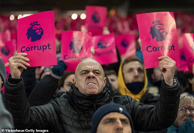 There was widespread anger among fans after the Premier League's initial decision - with home support holding up 'corrupt' signs during matches