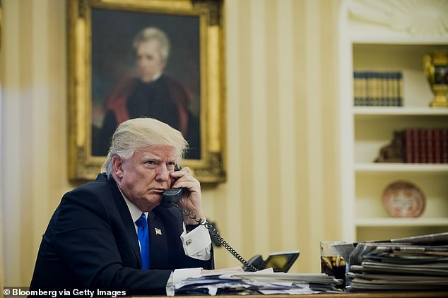 US President Donald Trump speaks on the phone with Malcolm Turnbull during their first official calls at the White House in Washington, DC