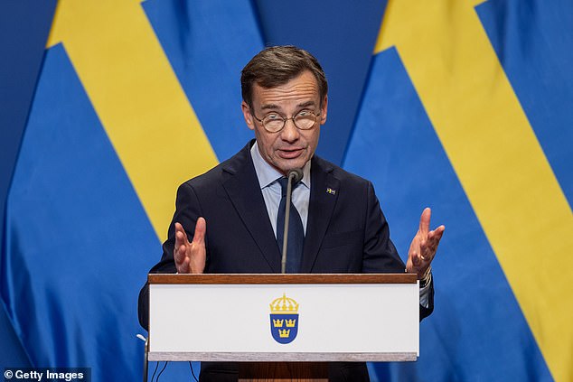 Swedish Prime Minister Ulf Kristersson speaks with his Hungarian counterpart Prime Minister Viktor Orban during a press conference after their meeting in Budapest, Hungary, on Friday