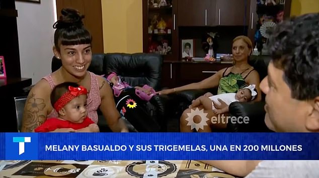 She announced their births to a local news station.  In the background sits her mother Marcela Frias who said the babies are the 