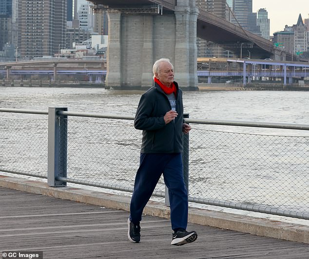 The Caddyshack star was filmed running under a bridge along the water