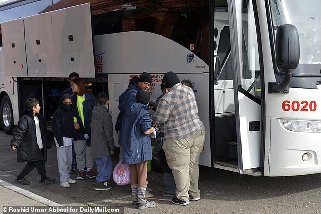 After processing in El Paso, Texas, migrants are loaded onto buses and shipped to Denver, Colorado