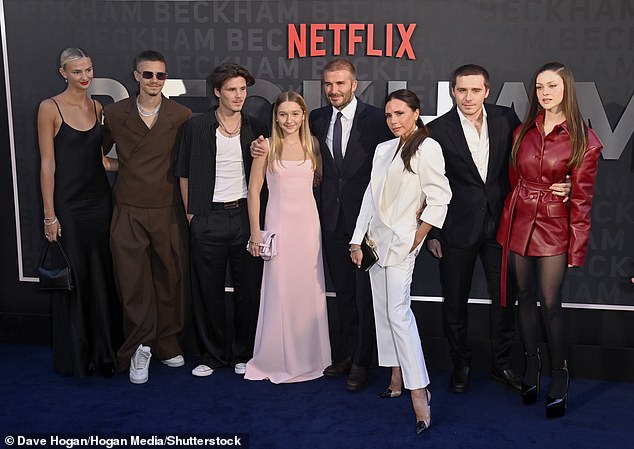 Former Spice Girl Victoria is said to be hoping to turn Brand Beckham into a multi-billion pound Kardashian-style empire (L-R: Mia, Romeo, Cruz Beckham, Harper Beckham, David, Victoria, Brooklyn Beckham and Brooklyn's wife Nicola Peltz pictured in October last year)