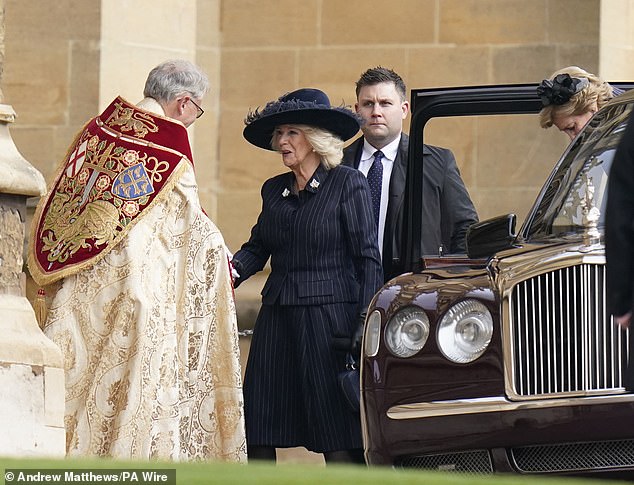 Queen Camilla is greeted today as she attends a service of thanksgiving for the life of King Constantine at St George's Chapel at Windsor Castle