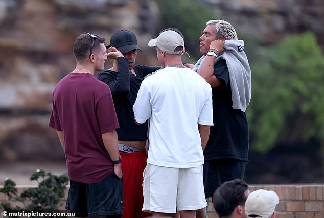 Shattered friends of Mr Baird and Mr Davies gathered on Bronte Beach for a vigil.