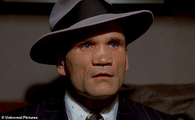 Here he is seen in a suit and hat as he plays a tough guy in 1973's The Sting, which also starred Redford and Newman.