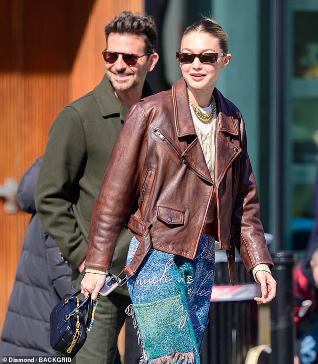 Cooper was dressed in an olive green jacket and matching pants, while Hadid wore a brown leather biker jacket
