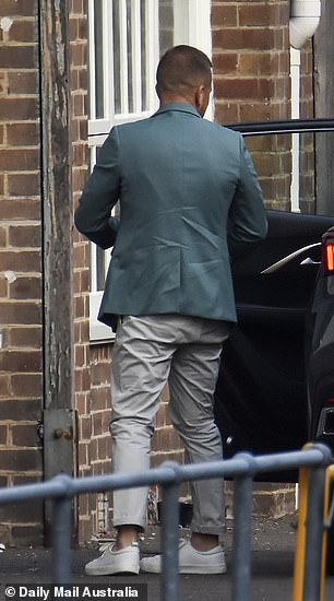 Ben looked dapper in beige trousers and a teal blazer