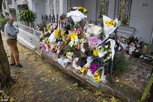 Floral tributes from friends, family and well-wishers adorn the veranda outside Jesse Baird's home in Paddington