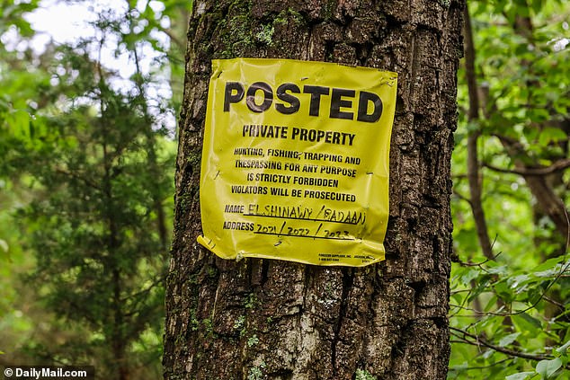 A private property sign is clearly visible attached to a tree where Haber allegedly paid the men to cut them down