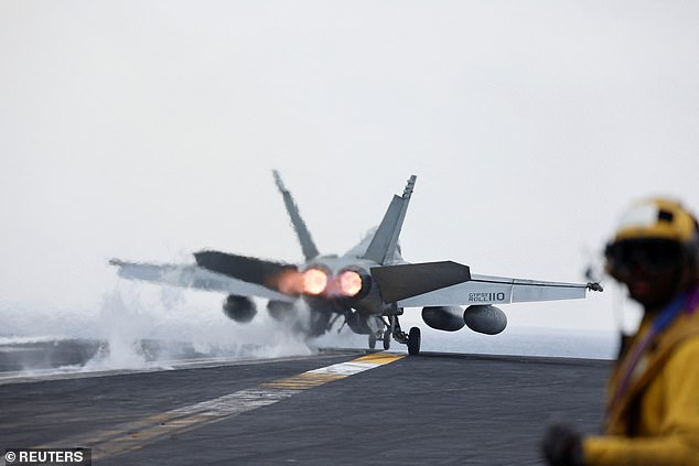 A US fighter jet is catapulted from the cockpit of a US aircraft carrier into the southern Red Sea