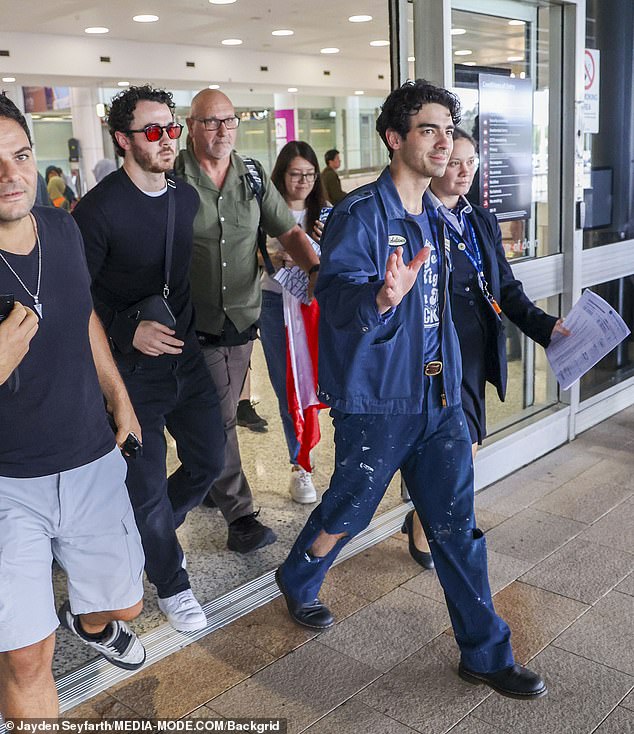 Joe, Nick and Kevin greeted fans as they arrived at Sydney Airport on Wednesday morning, ahead of their first concert at Qudos Bank Arena on Friday