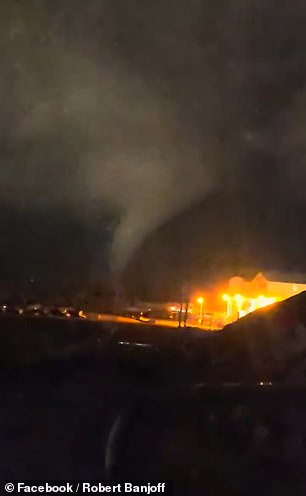 A flash of lightning could also be seen above a building