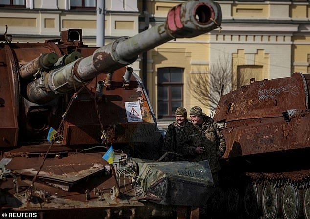 Ukrainian soldiers visit an exhibition of destroyed Russian military vehicles
