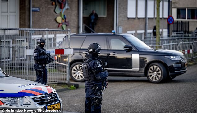 A secured car arrives at the extra-secure court on Tuesday for the verdict in the Marengo criminal case in Amsterdam