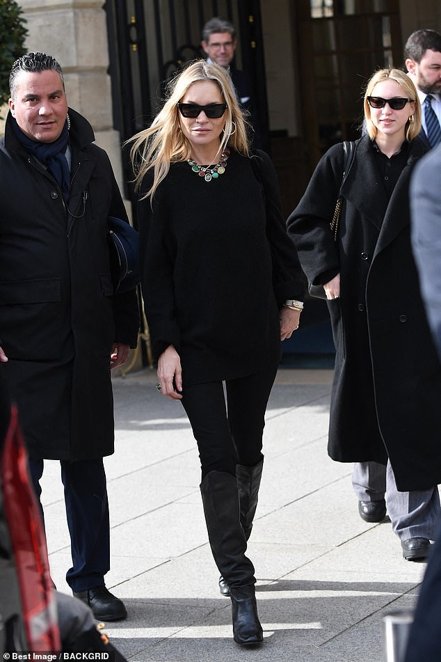 The style maven added height to her frame with a pair of knee-high black boots and also wore a statement multi-coloured necklace