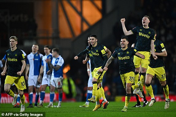 Newcastle United's teammates celebrate after winning, at the end of extra time, the English FA Cup fifth round football match between Blackburn Rovers and Newcastle United at Ewood Park in Blackburn, North West England on February 27, 2024. (Photo by Paul ELLIS / AFP) / LIMITED TO EDITORIAL USE.  No use of unauthorized audio, video, data, fixtures, club/league logos or 'live' services.  Online use during competitions limited to 120 images.  An additional 40 images can be used in the additional time.  No video emulation.  Use of social media during competitions is limited to 120 images.  An additional 40 images can be used in the additional time.  No use in betting, competition or individual club/competition/player publications.  / (Photo by PAUL ELLIS/AFP via Getty Images)