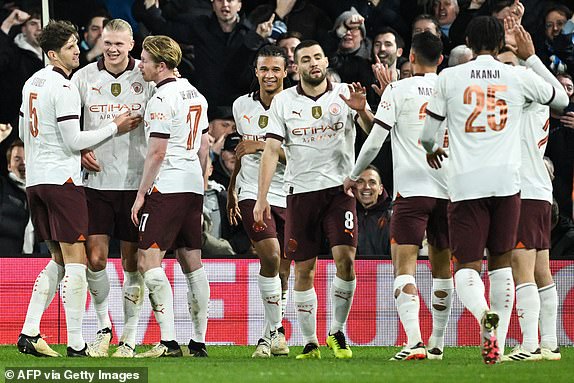 Manchester City's Norwegian striker #09 Erling Haaland (C) celebrates after scoring his team's fifth goal during the English FA Cup fifth round football match between Luton Town and Manchester City at Kenilworth Road Stadium in Luton, central England , on February 27, 2024. (Photo by JUSTIN TALLIS / AFP) / RESTRICTED TO EDITORIAL USE.  No use of unauthorized audio, video, data, fixtures, club/league logos or 'live' services.  Online use during competitions limited to 120 images.  An additional 40 images can be used in the additional time.  No video emulation.  Use of social media during competitions is limited to 120 images.  An additional 40 images can be used in the additional time.  No use in betting, competition or individual club/competition/player publications.  / (Photo by JUSTIN TALLIS/AFP via Getty Images)