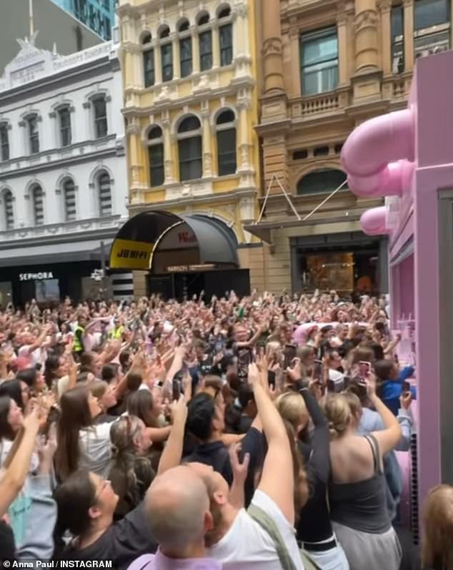 The dark-haired stunner shared a series of photos on Instagram, showing thousands of fans gathered outside the small store