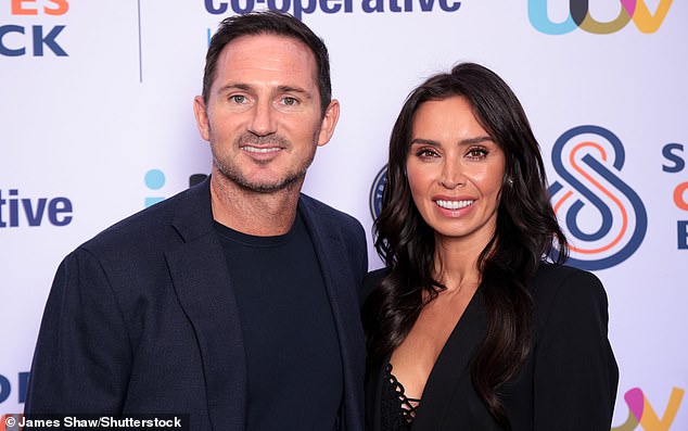 Christine wore a low-cut black lace-up shirt, a black jacket and a neat, ankle-length black skirt and showed off the huge stone on her wedding finger