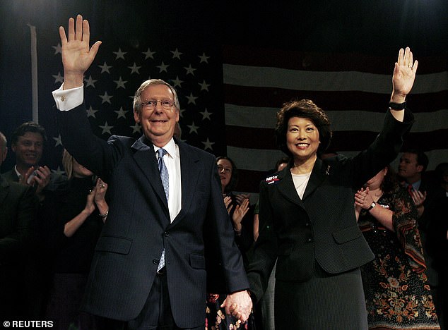 Mitch McConnell and his wife Elaine Chao wave to their supporters after he was re-elected to the Senate in 2004