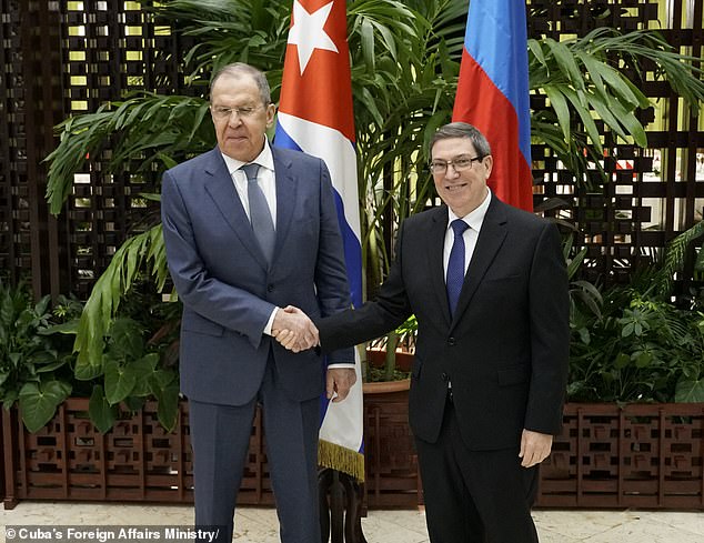 Russian Foreign Minister Sergei Lavrov (left) made no secret of his trip to the island as he posed for photos with Cuban Foreign Minister Bruno Rodriguez