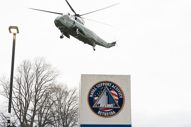 Marine One is seen landing at Walter Reed National Military Medical Center in Bethesda, Maryland, as President Joe Biden arrives for his physical.