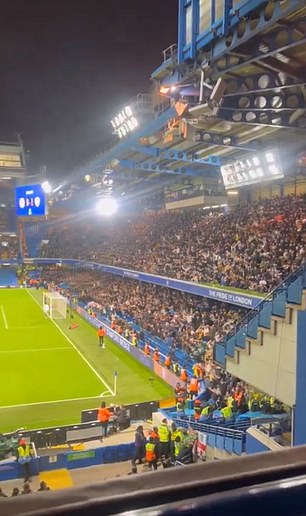 The fan ended up in empty seats between two stewards on the lower level